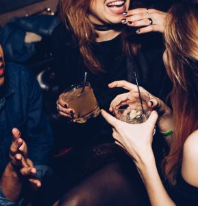 Image of young adults drinking at a casino nightclub