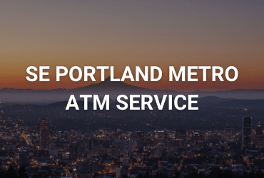 The words "South East Portland Metro ATM Service" are across the image in white. An orange sunset falls on a mountain overlooking a glowing town.